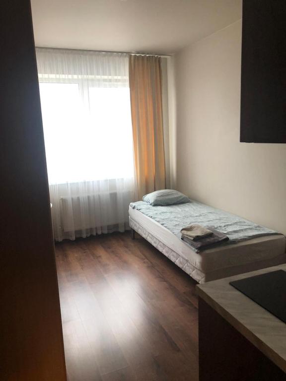 Postel nebo postele na pokoji v ubytování RVR Smart Apartments Riga with self Check-in