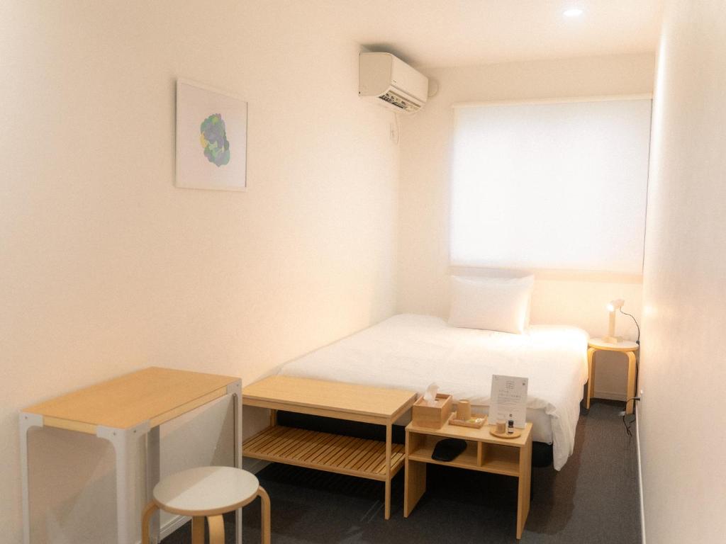 Postel nebo postele na pokoji v ubytování RAK KIYOMIZU - for one person - 1人旅専用HOSTEL