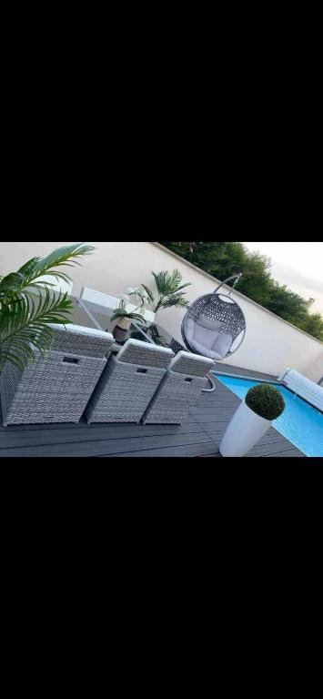a view of a table with a swimming pool at Maison calme avec piscine privée in Argenteuil