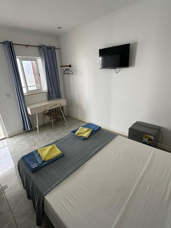 TV a/nebo společenská místnost v ubytování Hotel Kenito