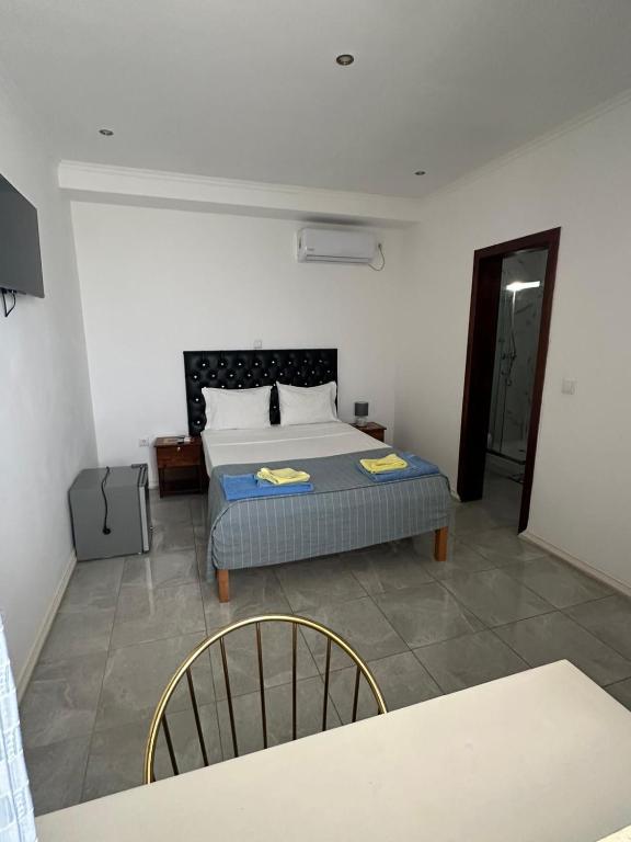 Postel nebo postele na pokoji v ubytování Hotel Kenito
