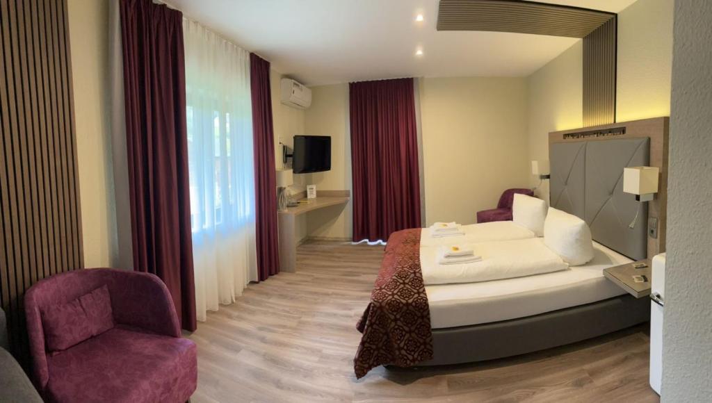 Postel nebo postele na pokoji v ubytování Landhotel Traube