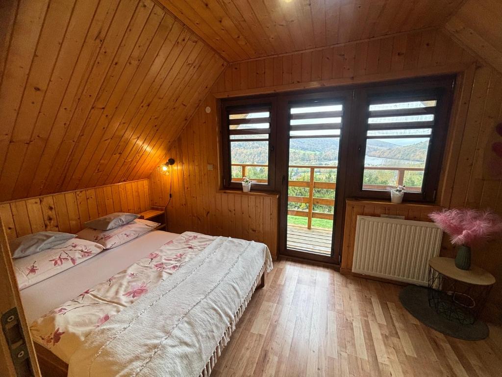 Postel nebo postele na pokoji v ubytování Chaty na Cholewicy Domki Całoroczne