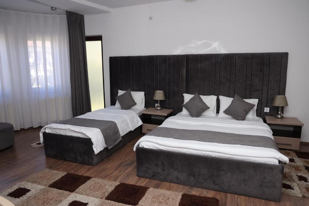 Postel nebo postele na pokoji v ubytování Hotel Cleon