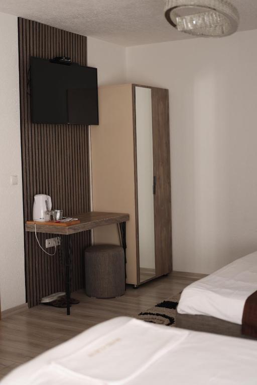 Postel nebo postele na pokoji v ubytování Hotel Cleon