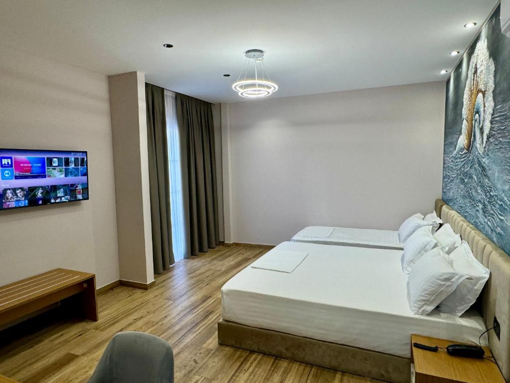 Postel nebo postele na pokoji v ubytování Residence Inn Tirana