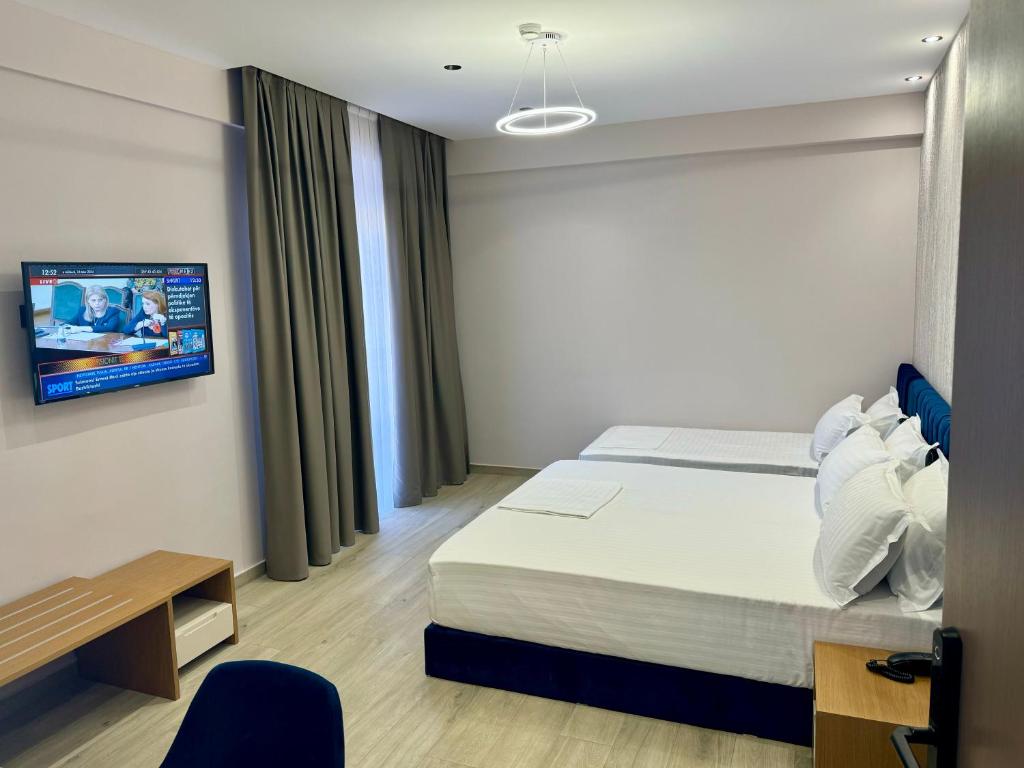 Postel nebo postele na pokoji v ubytování Residence Inn Tirana