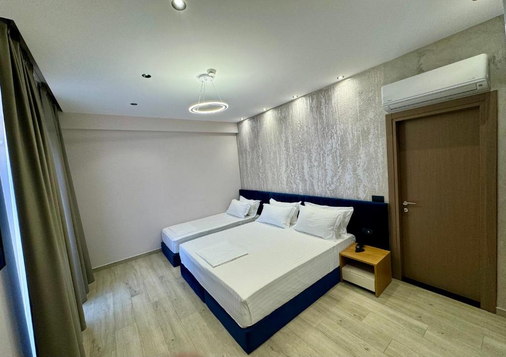 Postel nebo postele na pokoji v ubytování Residence Inn Tirana