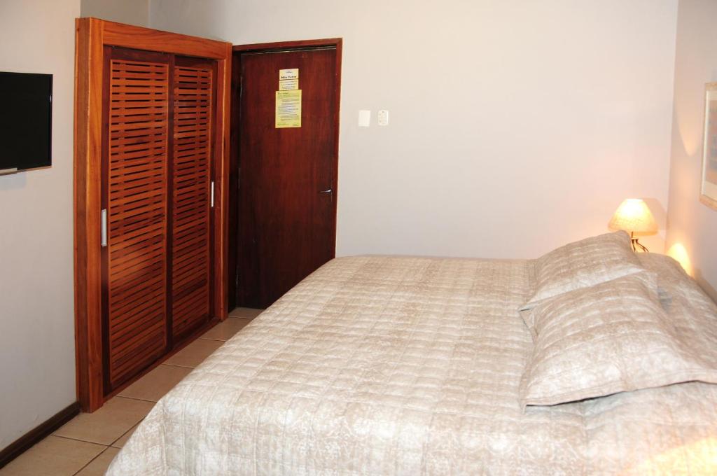 Postel nebo postele na pokoji v ubytování Hotel Daniela
