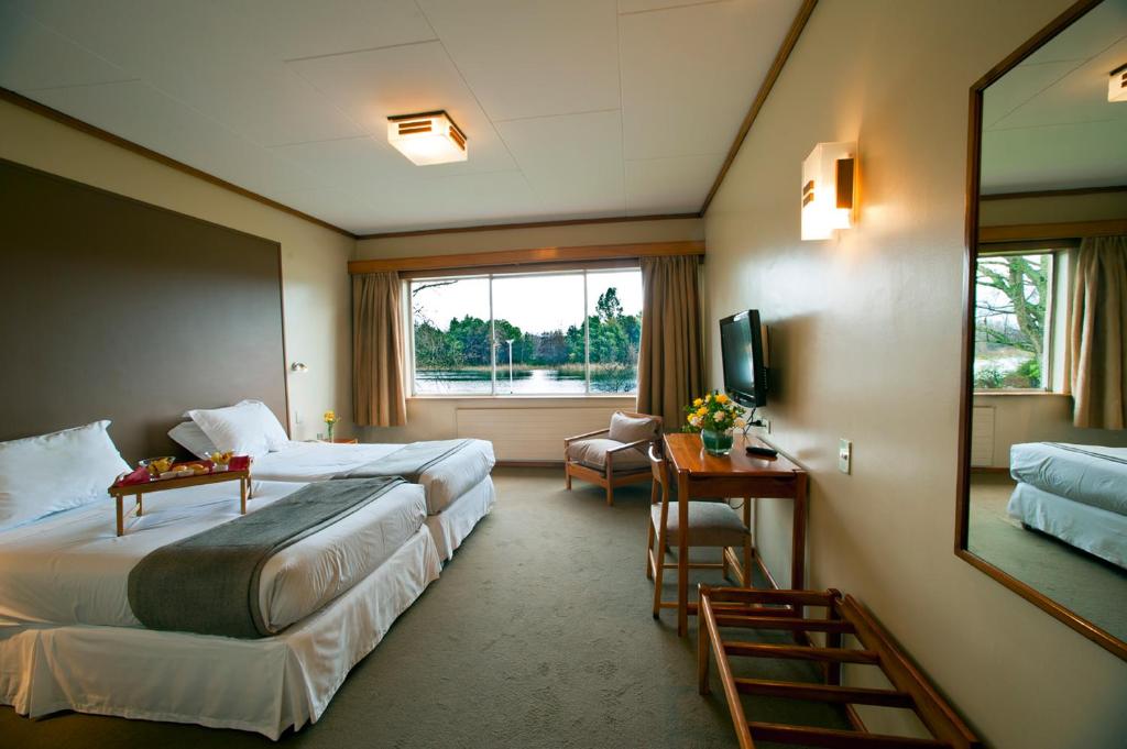 Postel nebo postele na pokoji v ubytování Hotel Naguilan