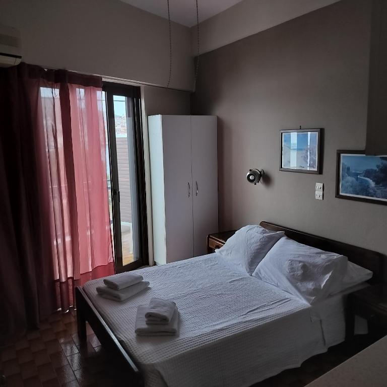 Postel nebo postele na pokoji v ubytování Bissias Guest House