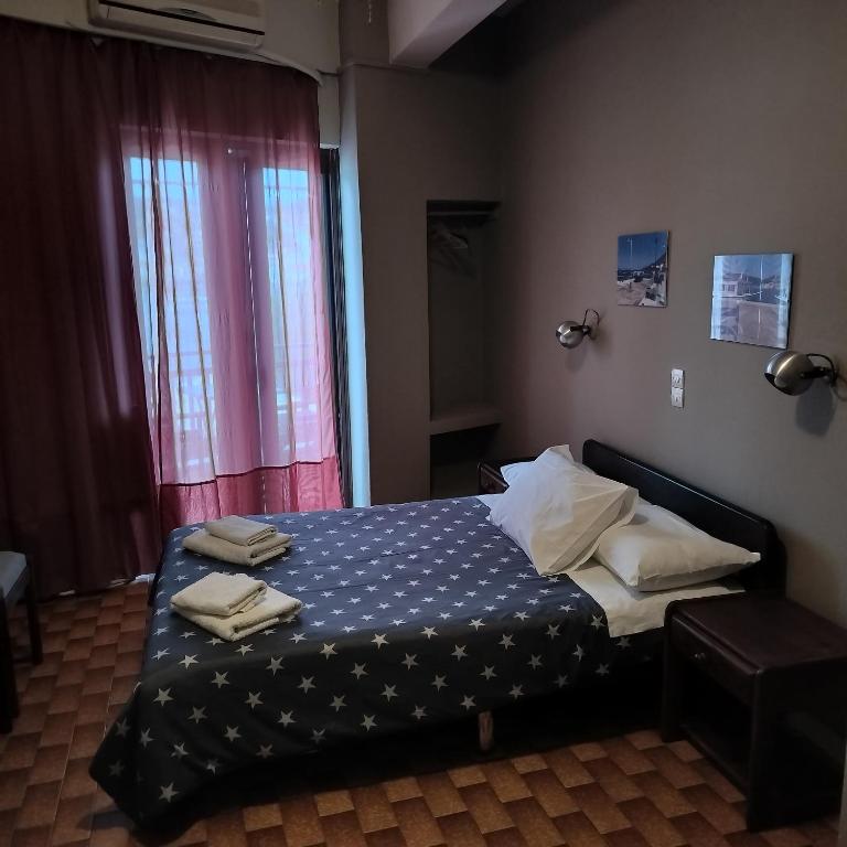 Postel nebo postele na pokoji v ubytování Bissias Guest House