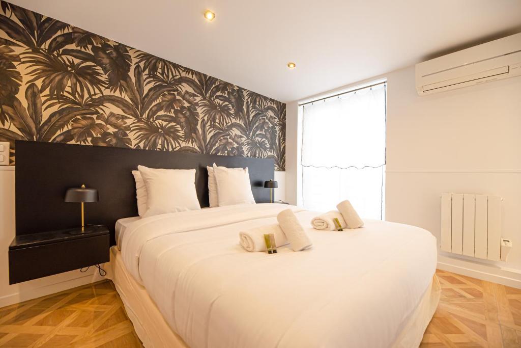 Uma cama ou camas num quarto em Cosy flats- NOTRE DAME