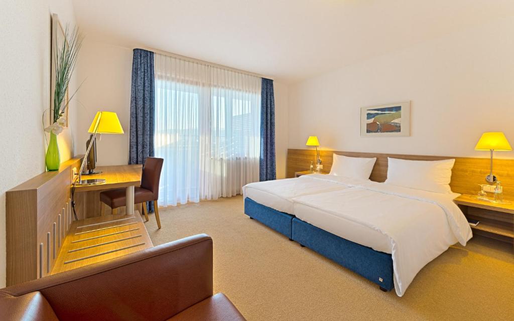 Postel nebo postele na pokoji v ubytování Sapia Hotel St. Fridolin