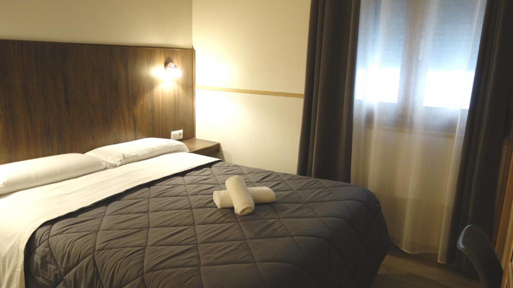 Postel nebo postele na pokoji v ubytování Trípolis Toledo