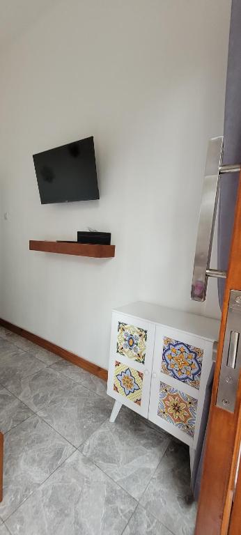 TV a/nebo společenská místnost v ubytování Umah Yugadi Bali