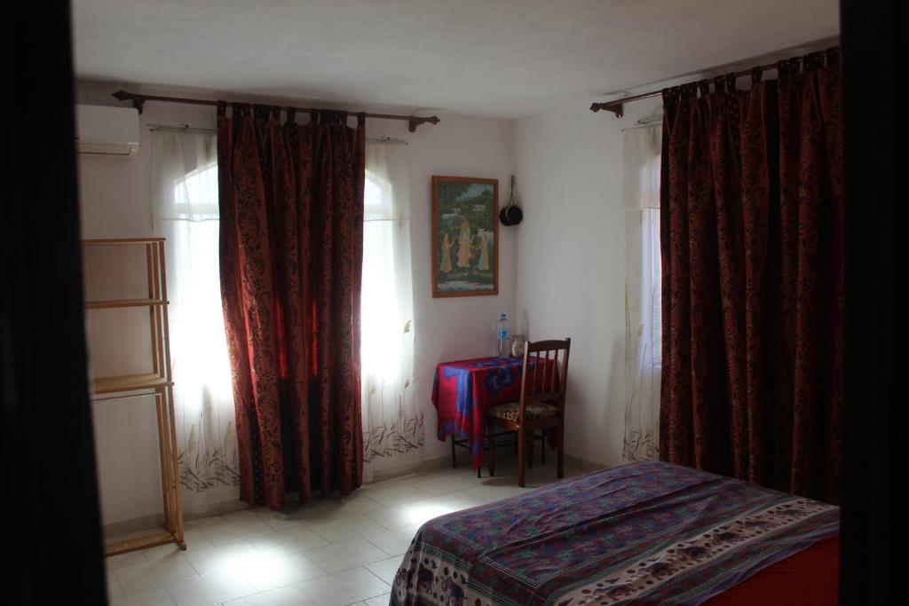 Postel nebo postele na pokoji v ubytování Souillac-Guest House