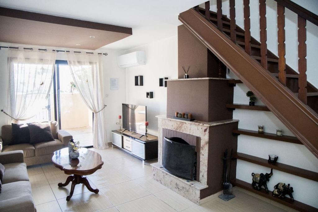 Posezení v ubytování Ocean Breeze Townhouse near Venus Beach