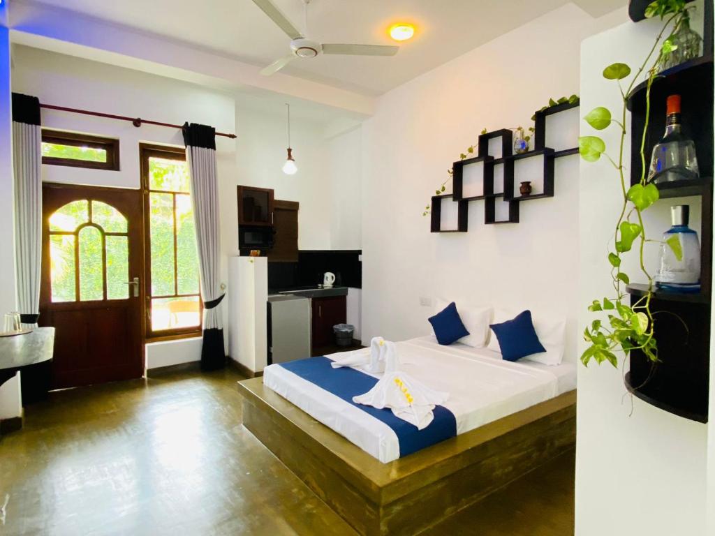 Postel nebo postele na pokoji v ubytování Sun Breeze Negombo