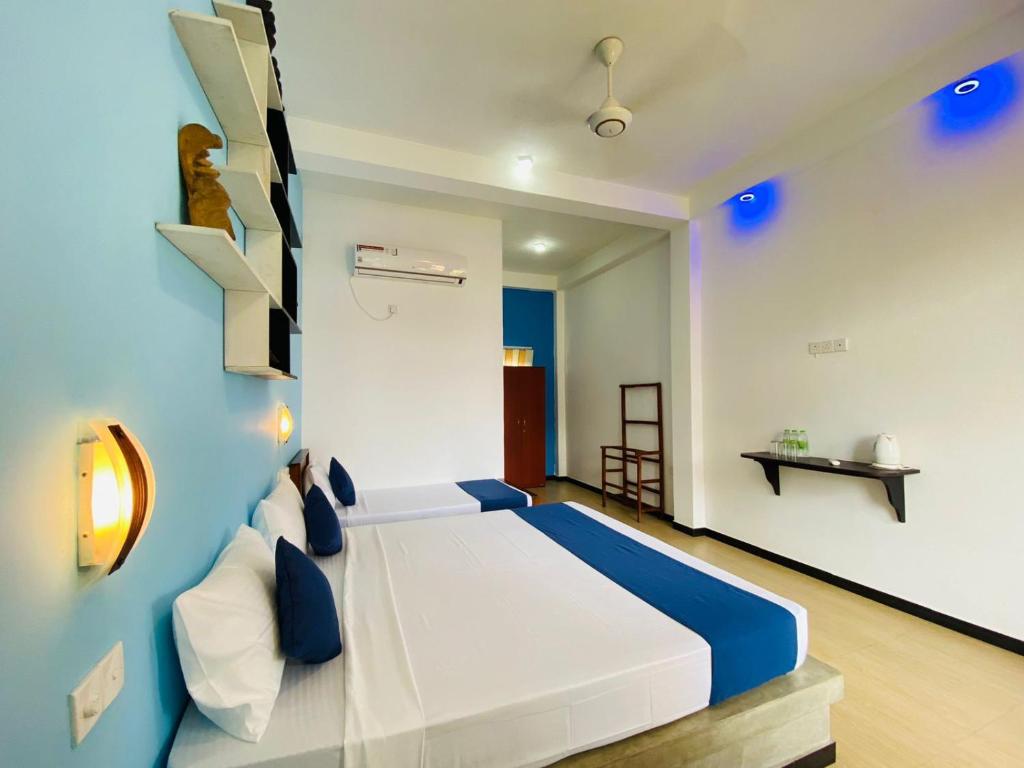 Postel nebo postele na pokoji v ubytování Sun Breeze Negombo