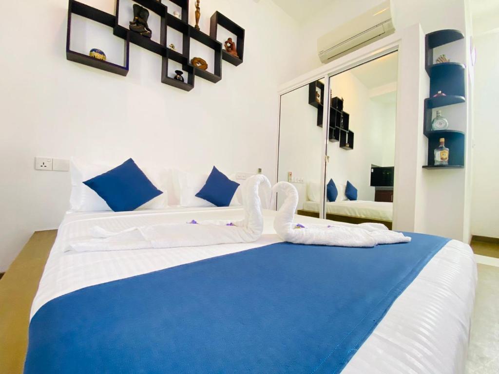 Postel nebo postele na pokoji v ubytování Sun Breeze Negombo