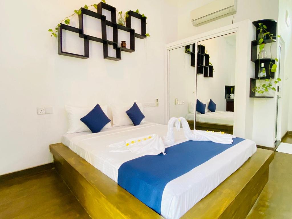 Postel nebo postele na pokoji v ubytování Sun Breeze Negombo