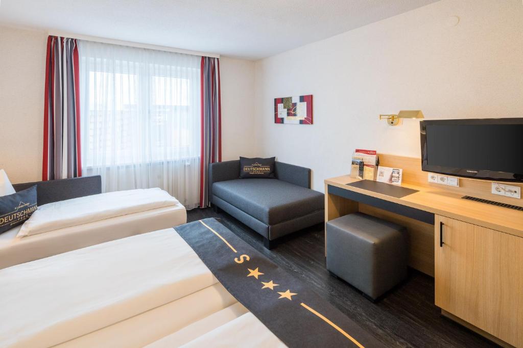 Postel nebo postele na pokoji v ubytování 4-Länder-Hotel Deutschmann
