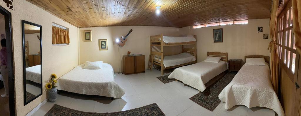 Cama o camas de una habitación en El Peregrino