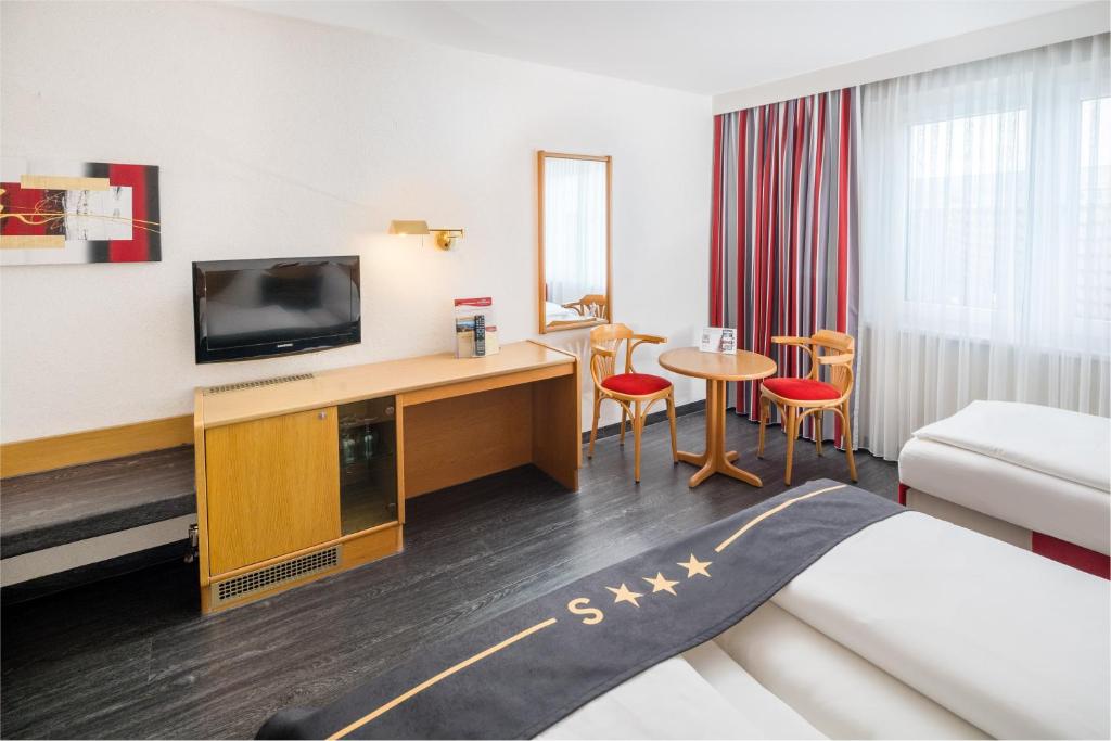 Postel nebo postele na pokoji v ubytování 4-Länder-Hotel Deutschmann