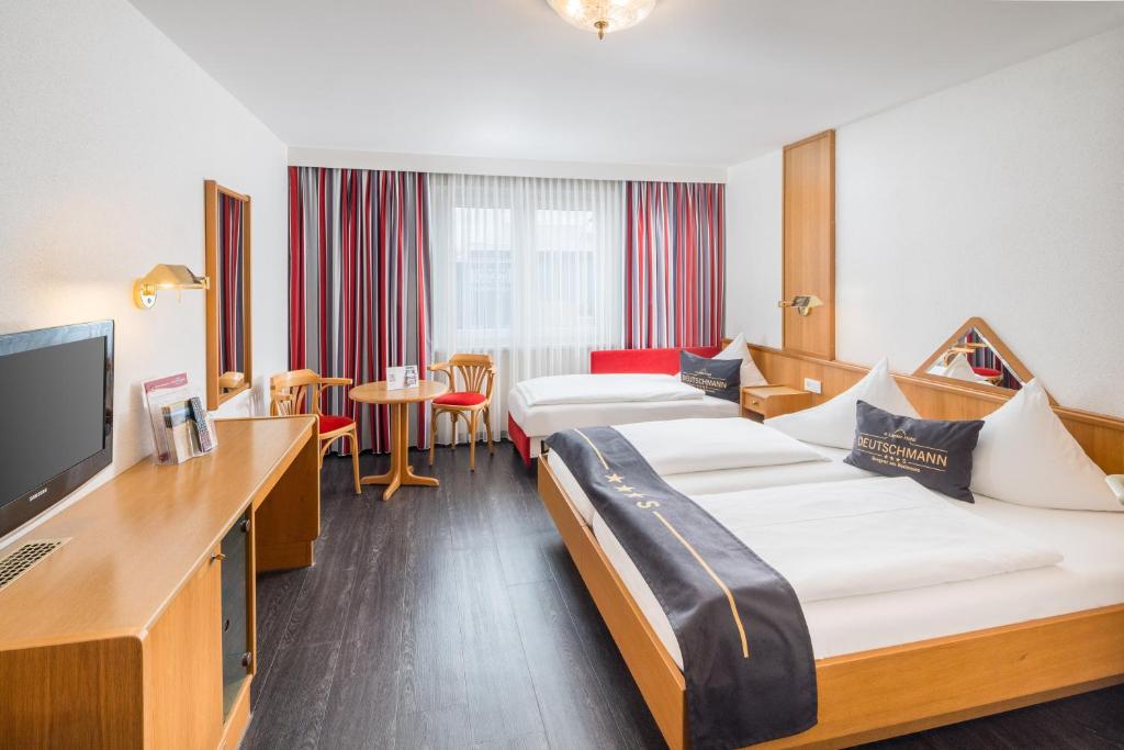 Postel nebo postele na pokoji v ubytování 4-Länder-Hotel Deutschmann