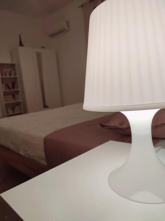A bed or beds in a room at Appartamento Aci Sant'Antonio