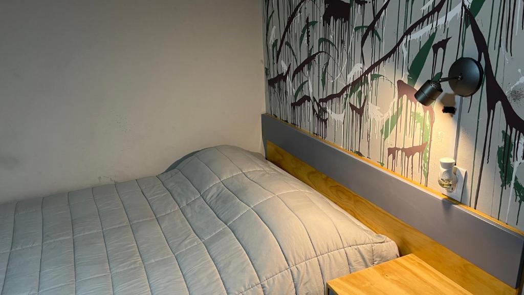 Postel nebo postele na pokoji v ubytování El Suburbio - Serapio Rendon