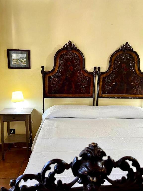 Postel nebo postele na pokoji v ubytování Case Di Loco Castro