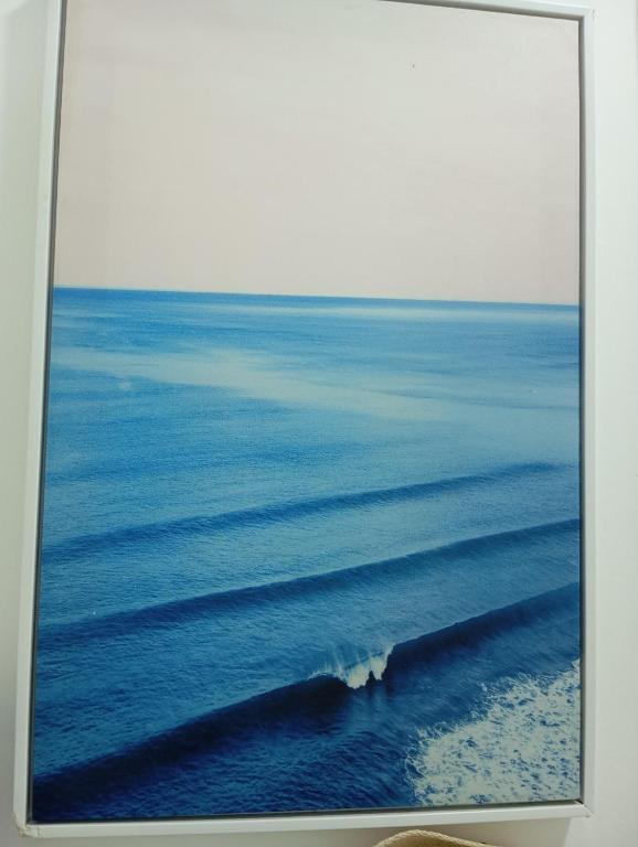 an aerial view of the ocean with a wave at Beira mar 2 in Santos