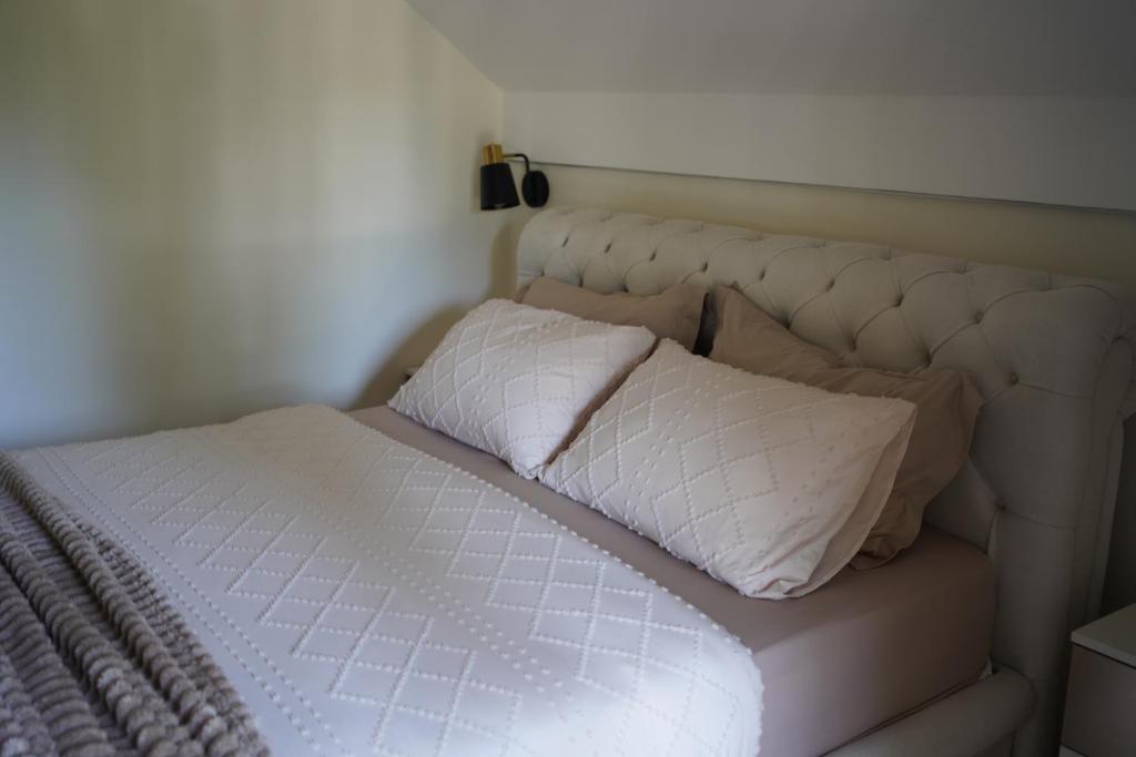 Postel nebo postele na pokoji v ubytování Star Hill Apartments