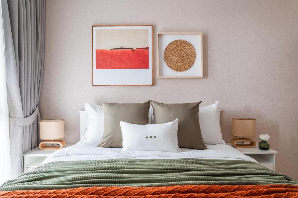 Ένα ή περισσότερα κρεβάτια σε δωμάτιο στο Title Halo Orange Sunset 46m2 Naiyang Pool&Gym