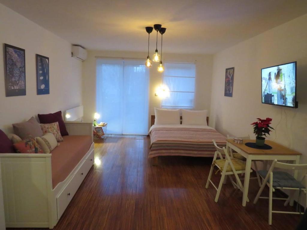 a living room with a couch and a table at Moj kutak in Vrnjci