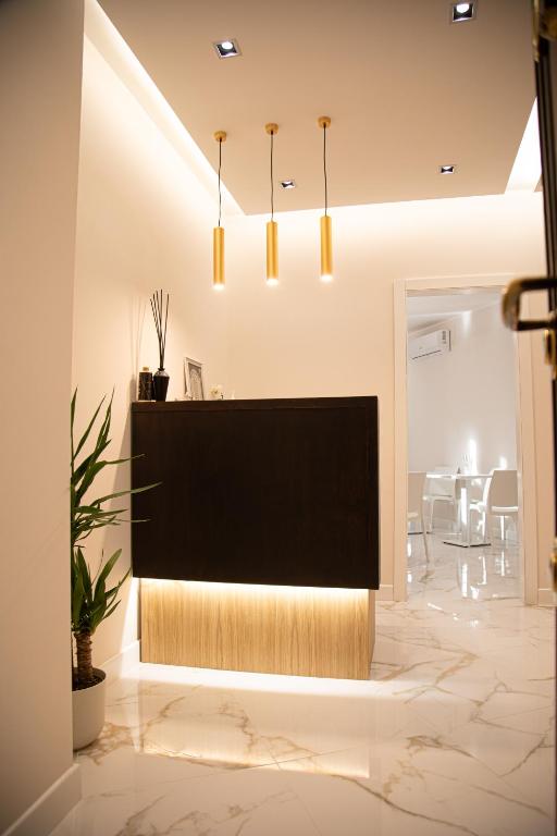 a living room with a large plasma tv in a room at Roxy luxury house Rome in Rome