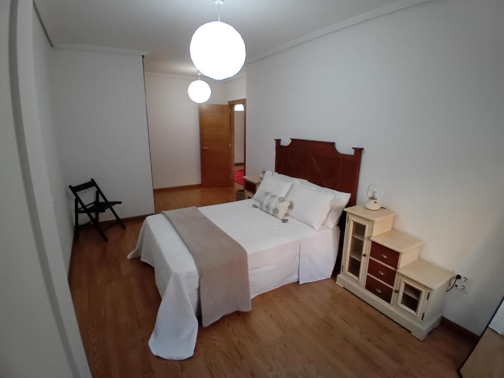 Posteľ alebo postele v izbe v ubytovaní Apartamento Reguiño al mar