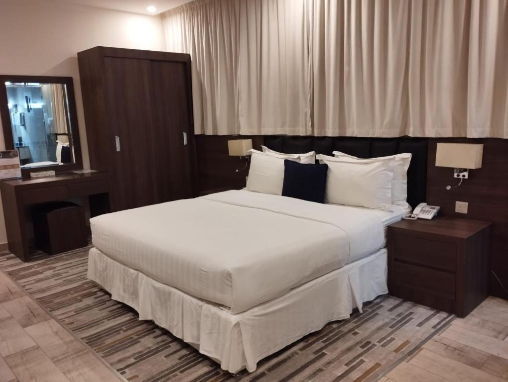 Postel nebo postele na pokoji v ubytování Olive Tree Hotel