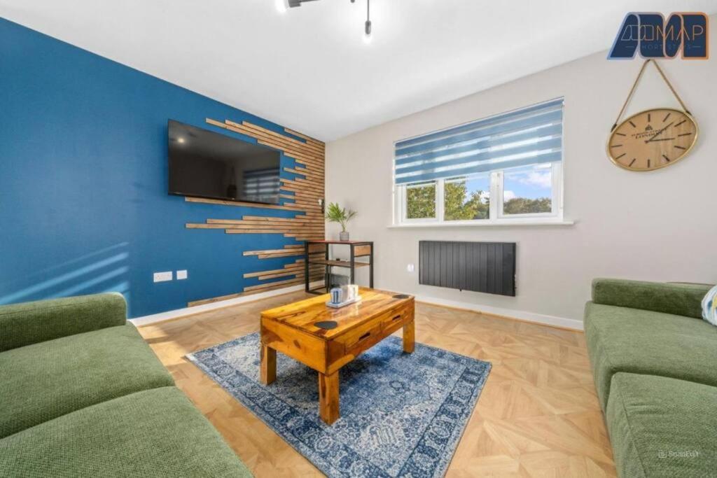 a living room with a couch and a coffee table at Elegant 2Bed Sleeps 4 With Parking in Paisley