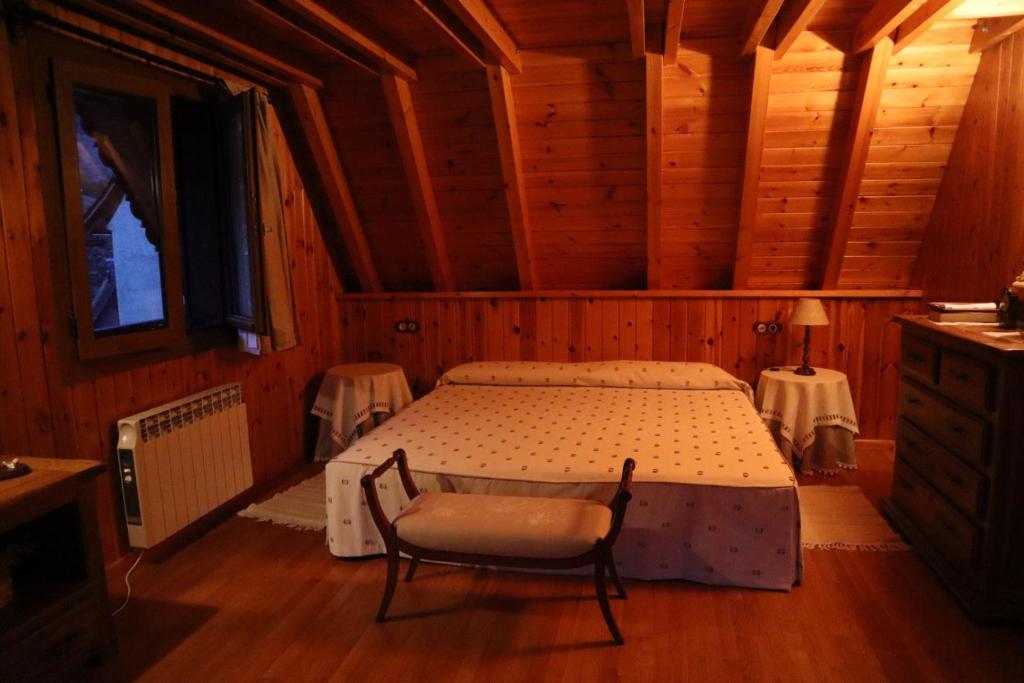 Postel nebo postele na pokoji v ubytování ERA CASETA de Salardu
