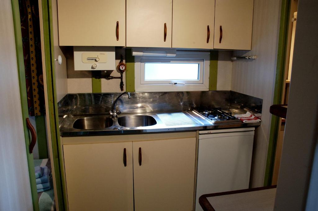 A kitchen or kitchenette at Camping As Cancelas