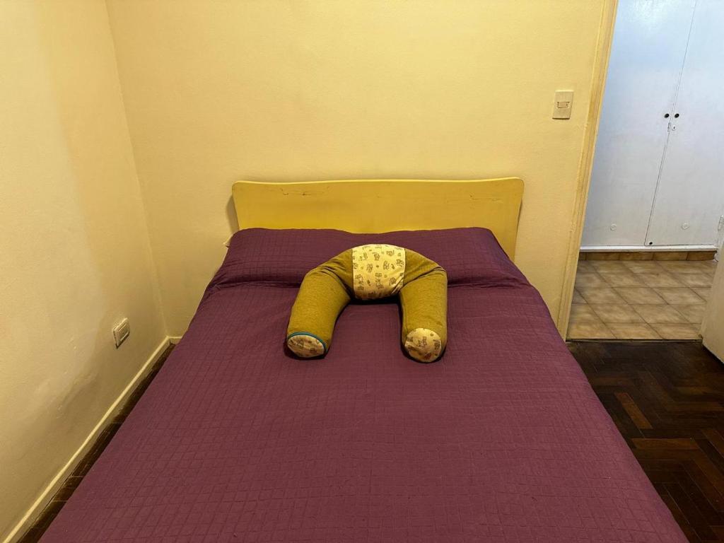 Ένα ή περισσότερα κρεβάτια σε δωμάτιο στο departamento "lo de lily"