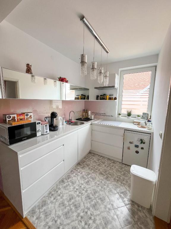 Kuchyň nebo kuchyňský kout v ubytování Elegant escape