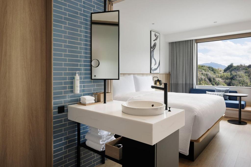 Fairfield by Marriott Kagoshima Sakurajimaにあるベッド
