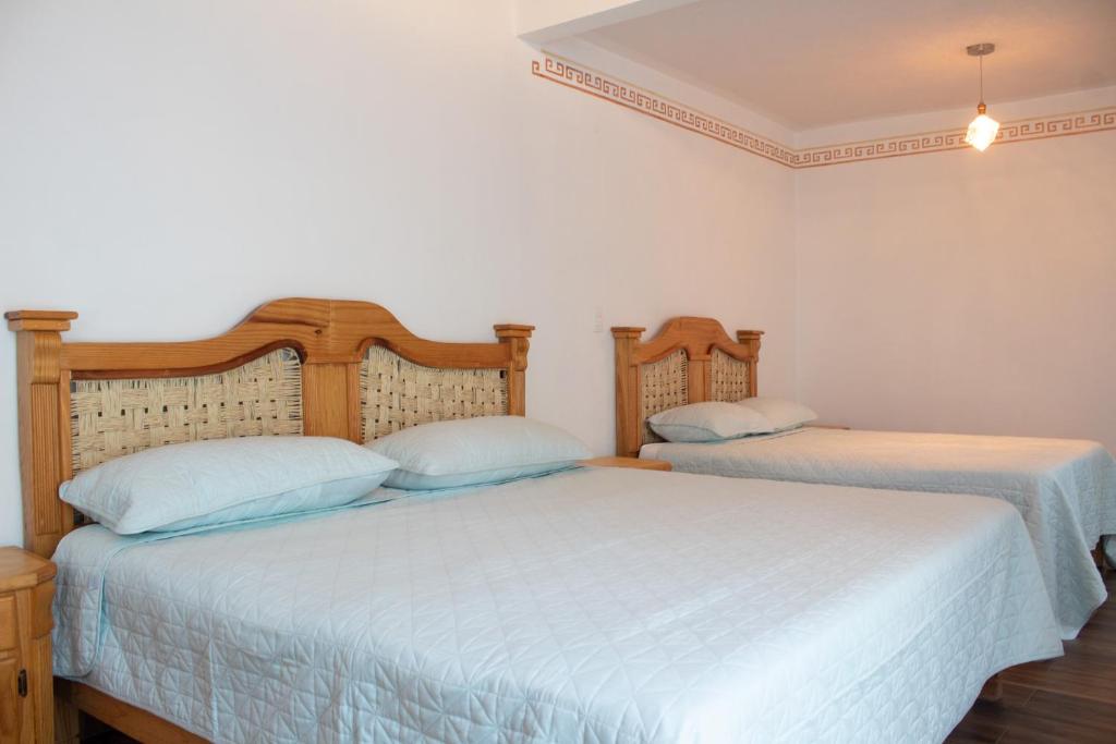 Letto o letti in una camera di Los Temazcales de Xochitepec