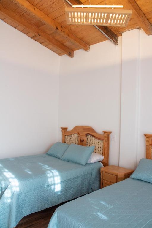 Letto o letti in una camera di Los Temazcales de Xochitepec