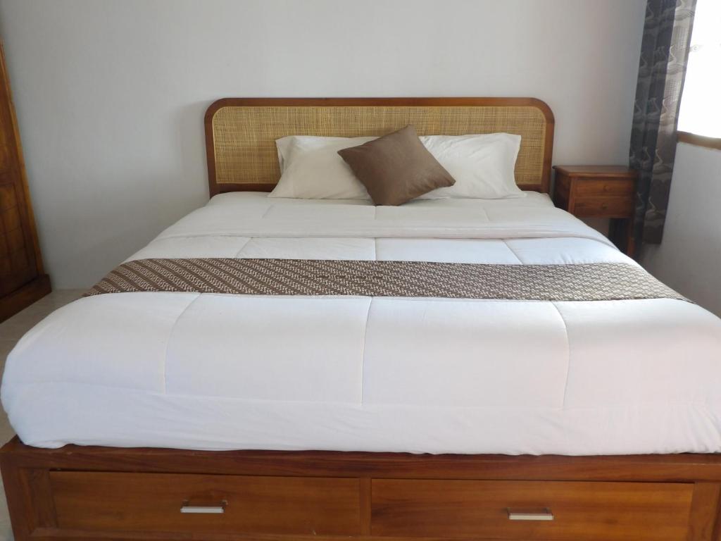 Postel nebo postele na pokoji v ubytování Geyu House
