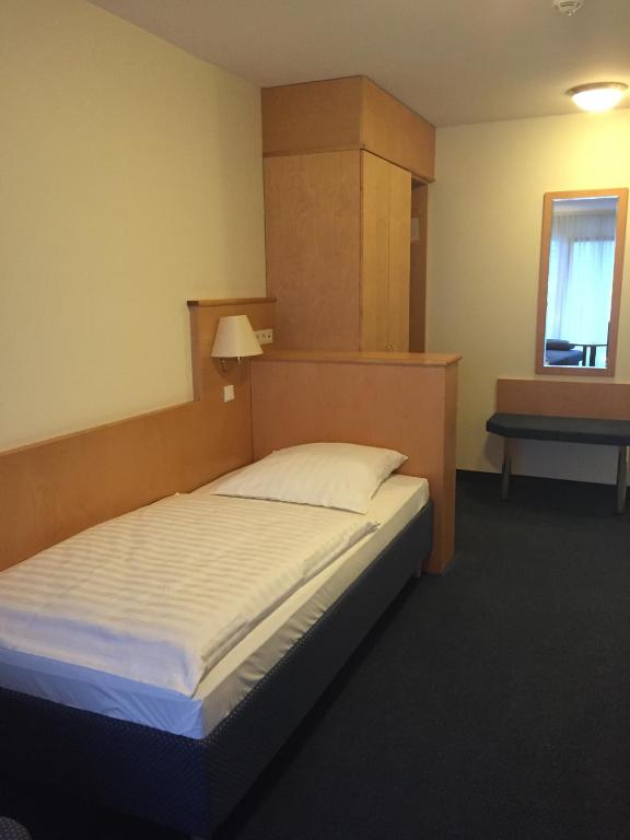 Postel nebo postele na pokoji v ubytování Hotel Görres